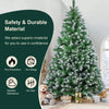A fully decorated 7ft realistic PVC artificial Christmas tree with white lights and a folding metal stand.