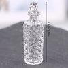 Clear glass miniature dollhouse vase and wine bottle set with intricate carved patterns