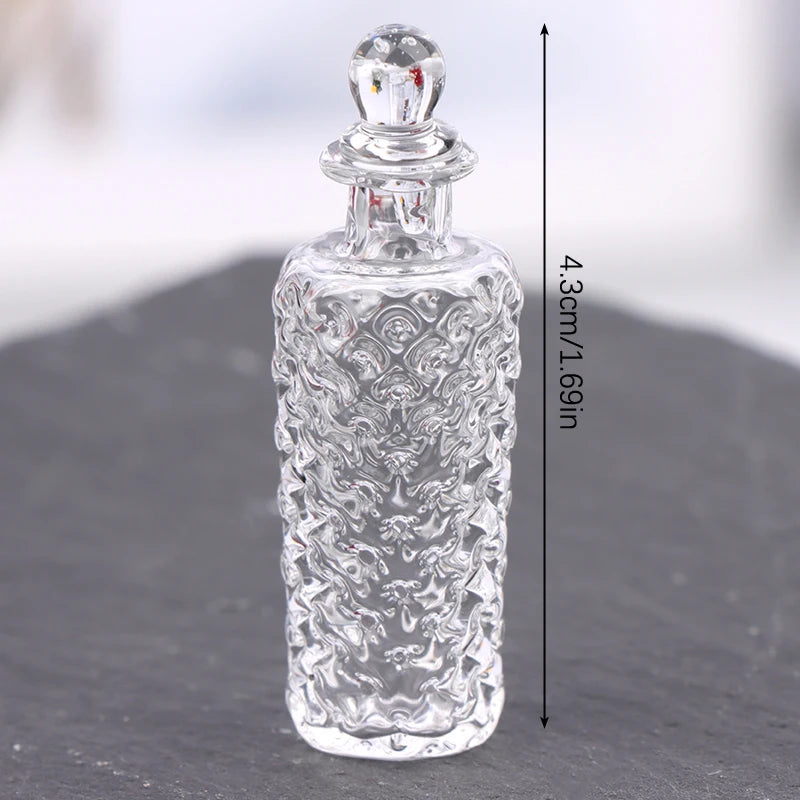 Clear glass miniature dollhouse vase and wine bottle set with intricate carved patterns