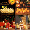 A collection of various colored and shaped LED tea light candles arranged on a wooden surface.