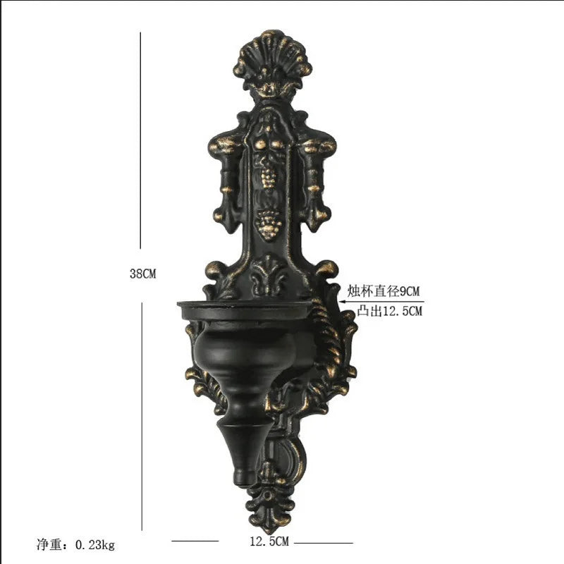 Vintage black wall-mounted double candle holder with ornate detailing and a 12.5cm opening.
