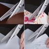Stainless steel pinking scissors with a zig zag blade cutting through leather, fabric, and felt.