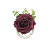A deep burgundy rose corsage bracelet featuring silk roses and pearl strands for weddings.