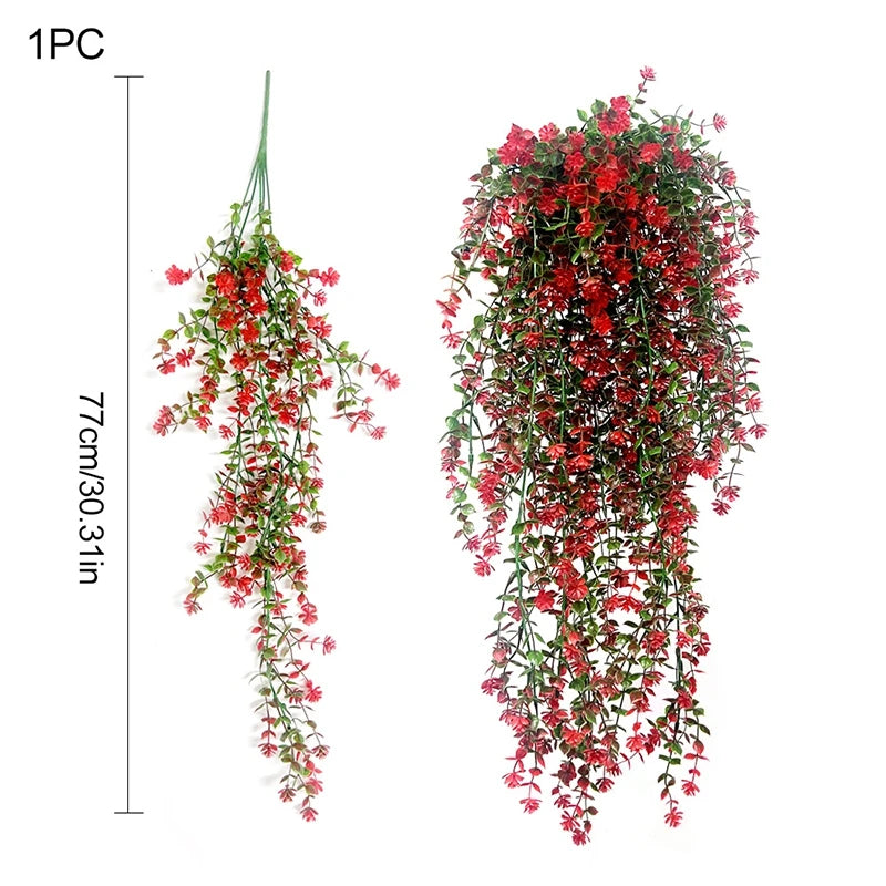 A bunch of vibrant red silk morning glory vine hanging flowers used for home decor.