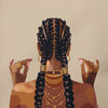 Back view of a woman with braided hair wearing gold jewelry, rendered in canvas art.