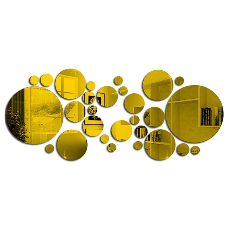 A collection of golden yellow acrylic mirror tiles arranged in a scattered, organic pattern.