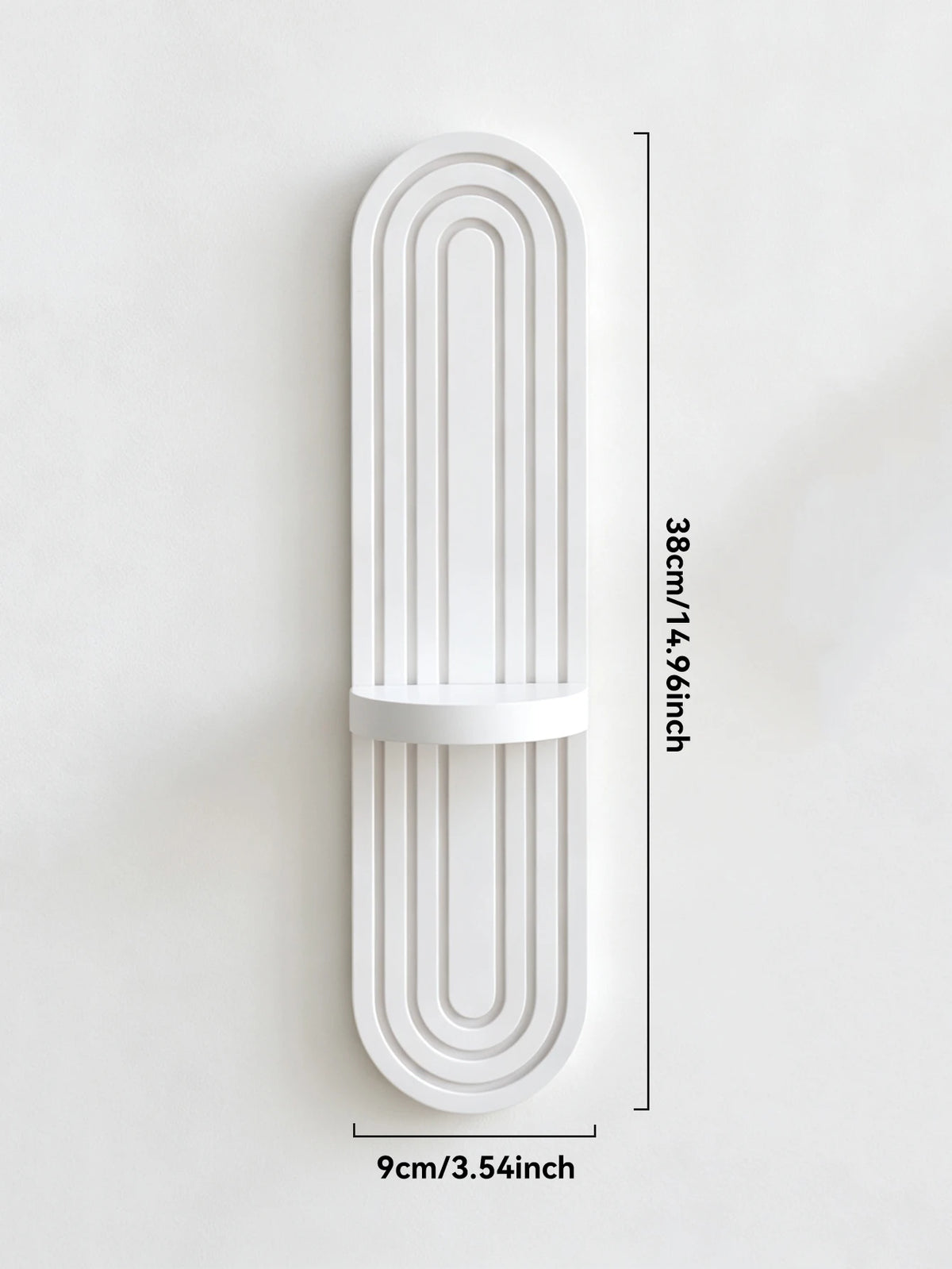 A white wooden wall shelf with a curved, arched design and vertical grooves.