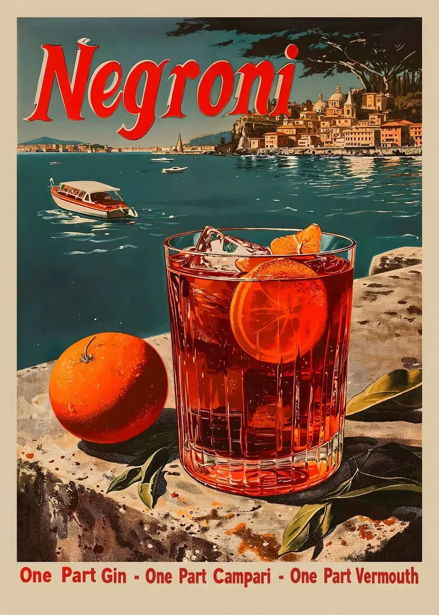 A glass of Negroni cocktail sits on a stone surface with an orange fruit nearby, set against a scenic background.