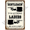 Vintage metal sign with text that reads Gentlemen to the left because Ladies are always right