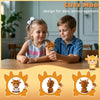 Two children smiling while holding crocheted Highland cow keychains as daily encouragement keepsakes.
