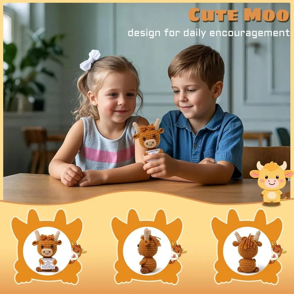Two children smiling while holding crocheted Highland cow keychains as daily encouragement keepsakes.