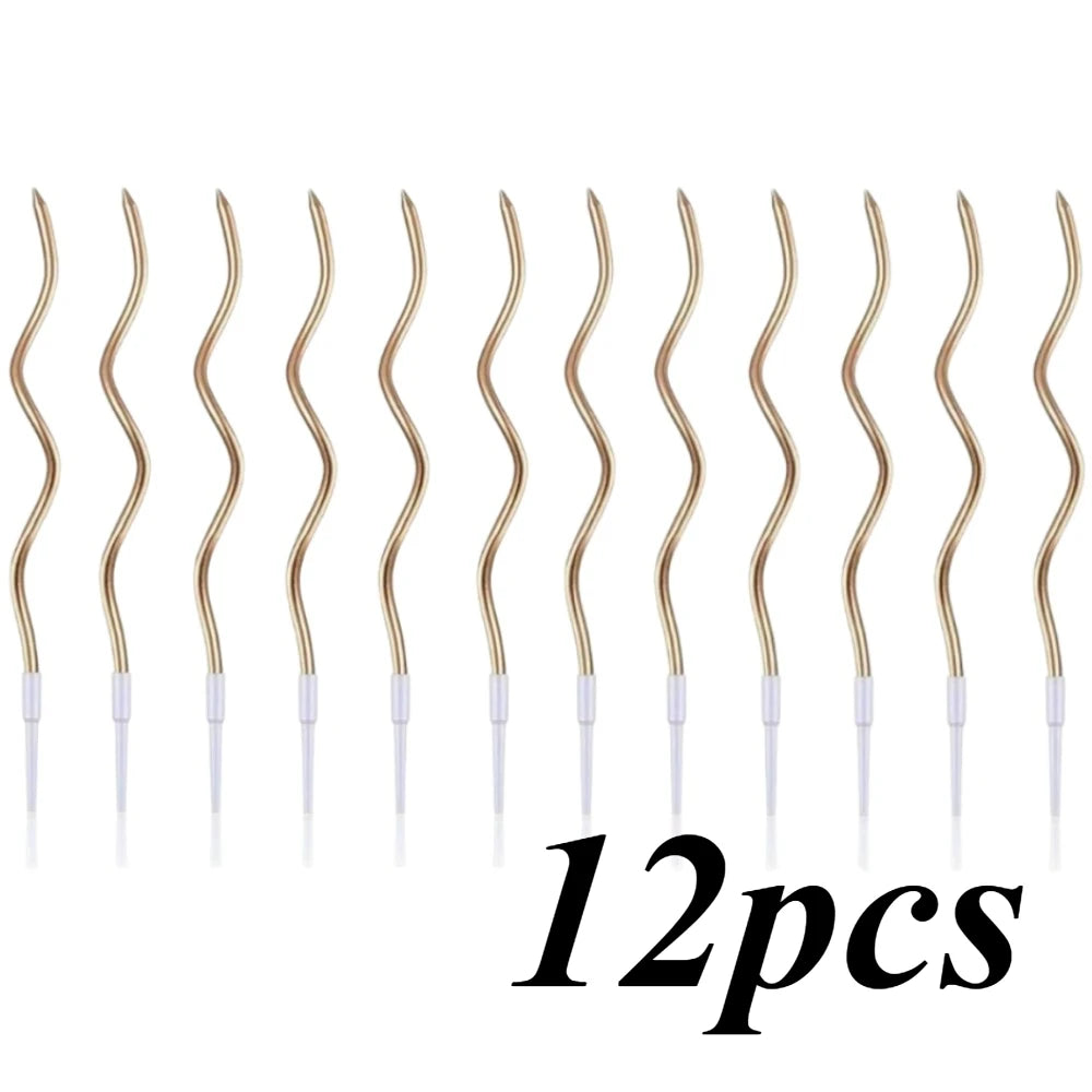 Twelve gold spiral birthday cake candles with star toppers arranged in a row.