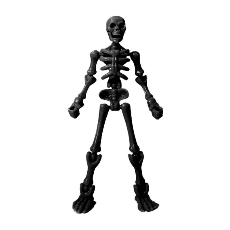 A dark gray plastic skeleton figurine with articulated bones.