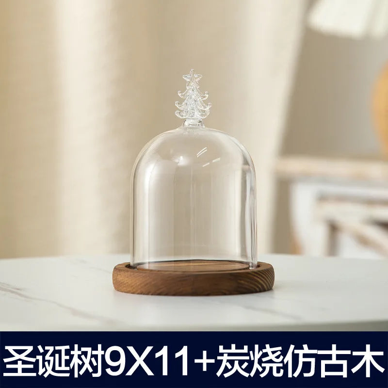 Glass aromatherapy candle holder with a clear dome and a wooden base