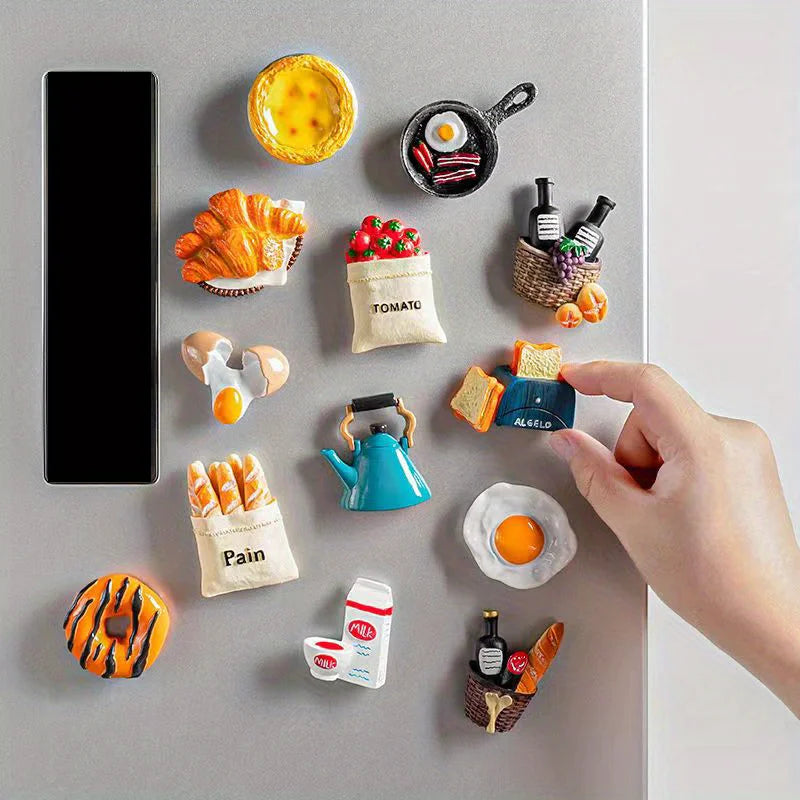 A collection of 3D resin food magnets featuring various food items like citrus, fruit, and savory snacks.