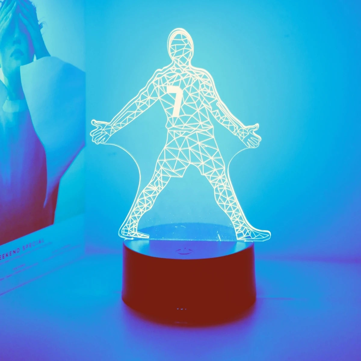 A glowing wireframe silhouette of a football player with the number 7 standing on a dark base.