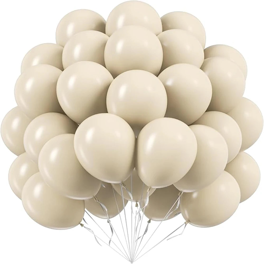 A cluster of cream and beige pastel latex balloons tied together for party decorations.
