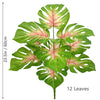 A cluster of 12 artificial monstera plant leaves with green and pink variegation.