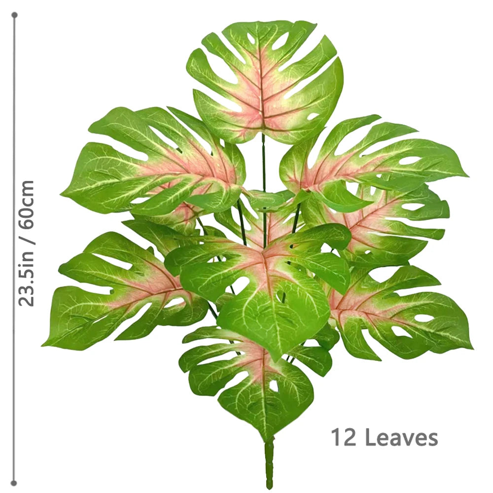 A cluster of 12 artificial monstera plant leaves with green and pink variegation.