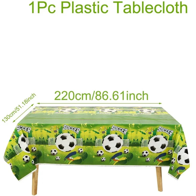 Green plastic tablecloth measuring 220cm long used for a soccer party.