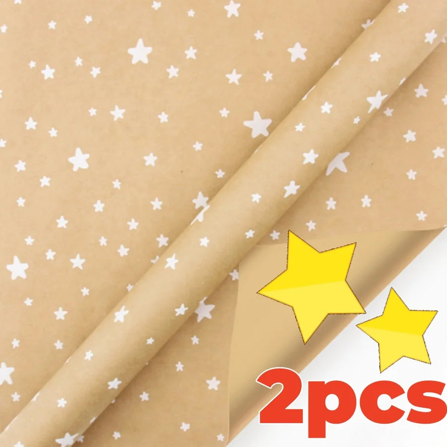 Two rolls of festive snowflake Christmas wrapping paper.