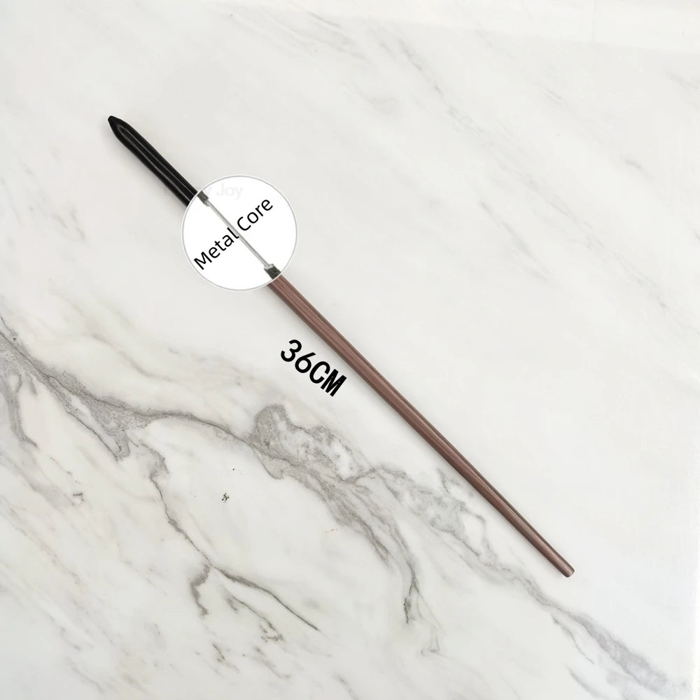 A long, slender metal wand replica with a circular head and a 36cm length resting on a white marble surface.