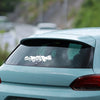 A close-up of a light blue car with a white skull and skeleton decal on the rear window.