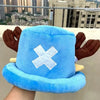 A light blue knit cap plush toy featuring a white 'X' design and brown ears.