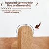 Close-up of a wooden coat rack wall mount showing rounded corners and smooth edges.