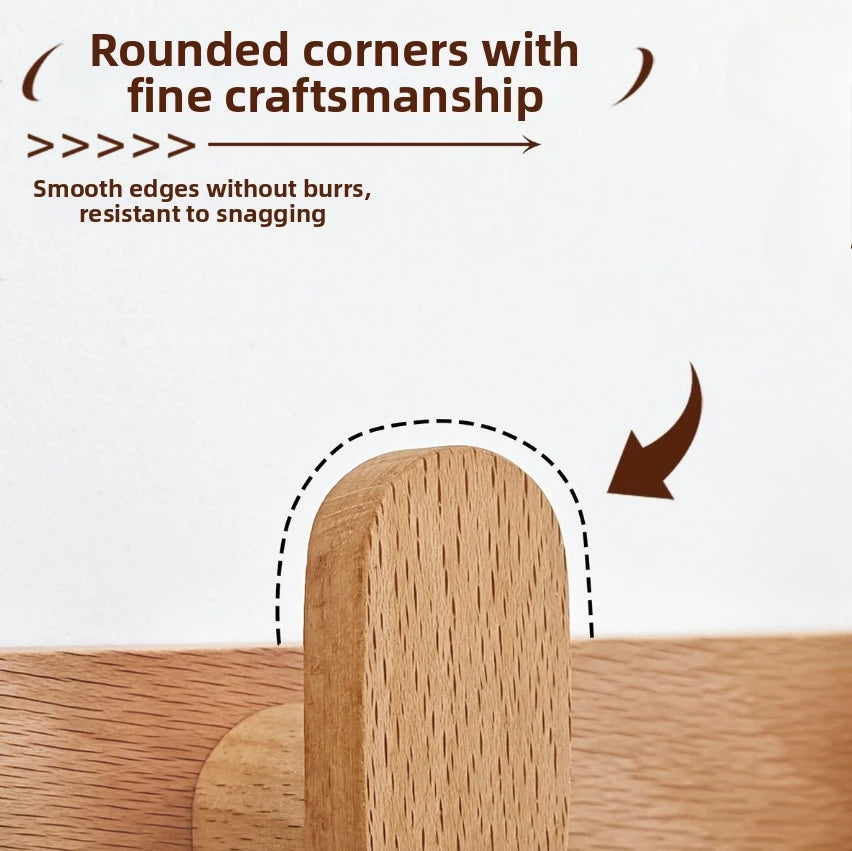 Close-up of a wooden coat rack wall mount showing rounded corners and smooth edges.
