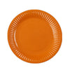 An orange disposable plate with ribbed edges.