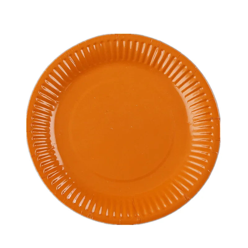 An orange disposable plate with ribbed edges.