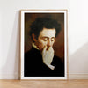 A framed oil painting portrait of a man with dark hair and a white collar, looking down thoughtfully.