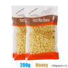 A package of Hard Wax Beans for body hair removal, showing yellow wax beans in a clear plastic bag.