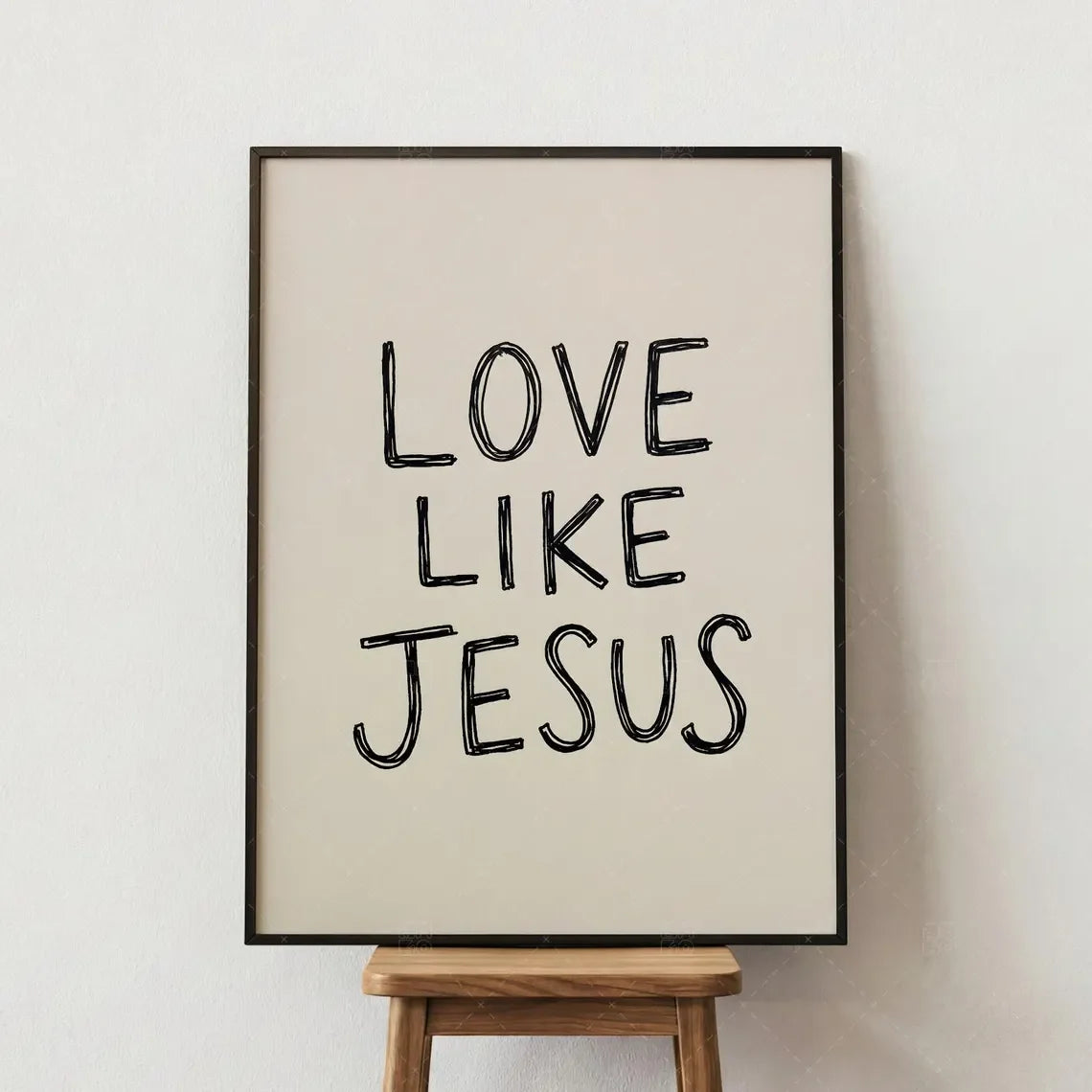 Framed wall art print with black text that reads Love Like Jesus on a light background.
