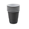 A stack of five disposable red shot glasses.