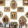 A gallery wall display featuring ornate gold-framed photo displays of couples and individuals.