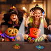 Four children pose with Halloween LED finger projectors casting spooky light patterns on a dark surface.
