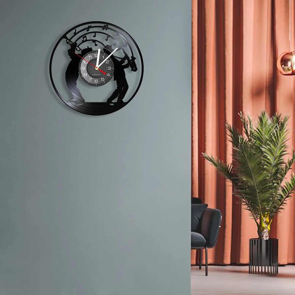 A black vintage vinyl record wall clock featuring a silhouette of a horse and rider against a light gray wall.