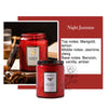A dark red jar of Night Jasmine scented candle with a gold label and surrounding botanical elements.