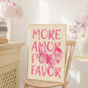 A framed canvas print featuring the pink watercolor text MORE AMOR POR FAVOR on a light background.