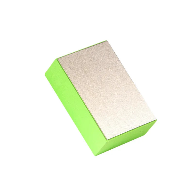 A rectangular polishing pad with a bright lime green frame and a light beige, textured surface.