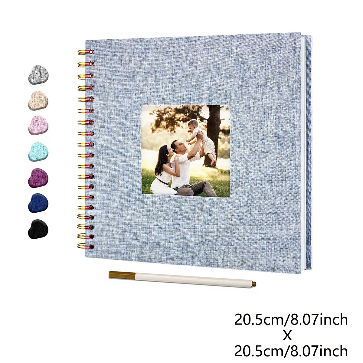 A light blue linen cover scrapbook album with a spiral binding and a photo insert showing a couple embracing.