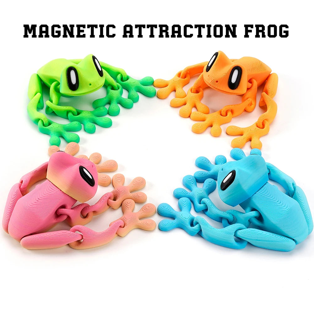 A set of three articulated 3D printed frog magnets in green, orange, and blue.
