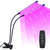A purple USB LED plant grow light with a flexible arm and an accompanying remote control is shown illuminating a pink backgro