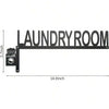 Black metal wall decor sign with the words LAUNDRY ROOM and a switch.