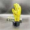 A golden glove award trophy for football fans displayed on a dark surface.