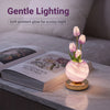 A pink marble vase holds a single light purple tulip, serving as a gentle lighting night light.