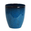 A deep blue, textured resin planter with a slightly flared rim and a small saucer.