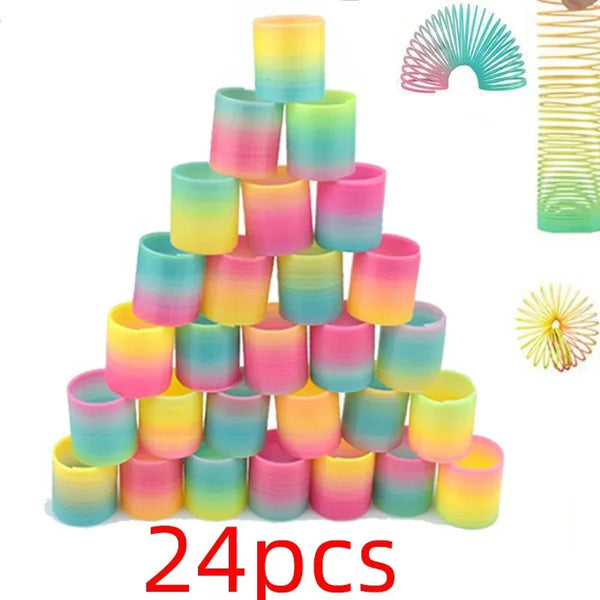 A stack of 24 colorful, translucent silicone spring toys in a rainbow gradient pattern.